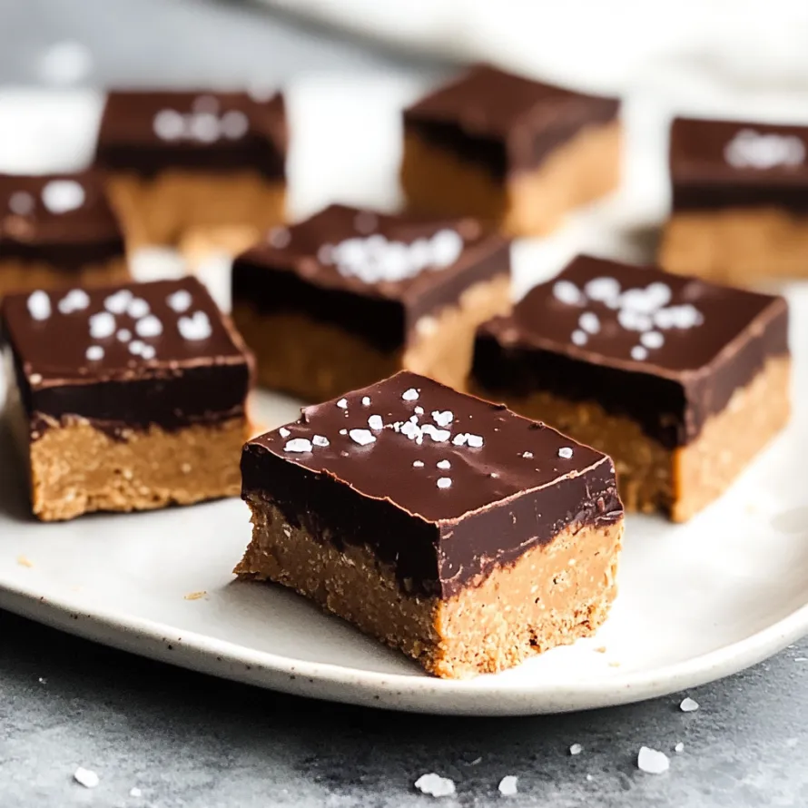A plate of chocolate desserts with white sugar sprinkled on top.
